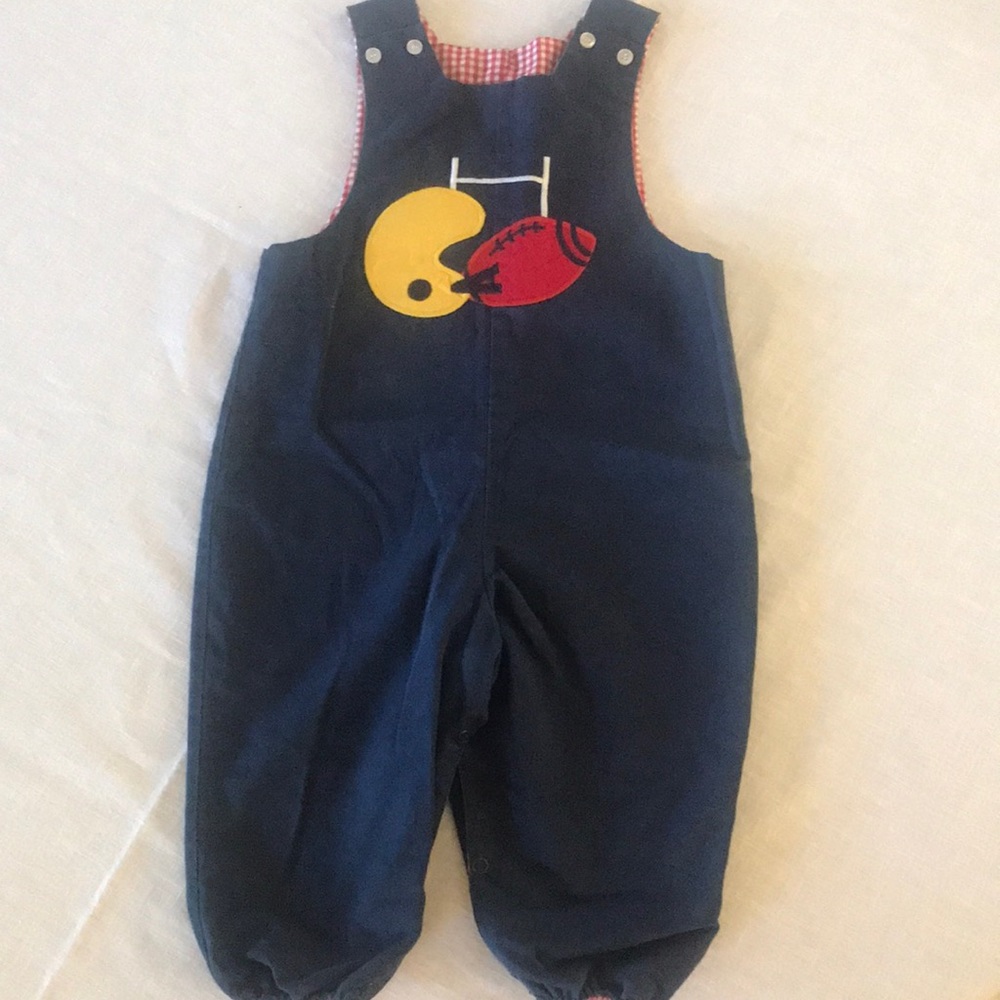 Adorable navy blue corduroy jumper with football appliqué